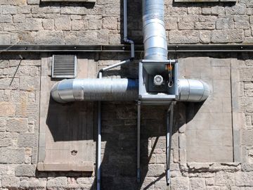 Demand controlled Mechanical extract ventilation system installed on a building